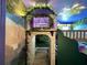 Custom-designed bedroom with stone accents, bunk beds, murals, and decorative details at 4473 Kaipo Rd, Davenport, FL 33897