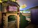 Themed bedroom featuring a unique bunk bed with stone facade and a mural on the ceiling and wall at 4473 Kaipo Rd, Davenport, FL 33897
