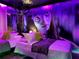 Unique bedroom featuring a vibrant 'Avatar' mural, soft lighting, and plush bedding at 4473 Kaipo Rd, Davenport, FL 33897