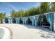Private poolside cabanas offer a shady retreat for relaxation at 4473 Kaipo Rd, Davenport, FL 33897