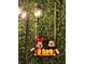 Mickey and Minnie Mouse plush figures sit on a swing adding a whimsical touch at 4473 Kaipo Rd, Davenport, FL 33897