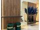 Elegant entryway with decorative mirrors, accent furniture, and modern design elements at 4473 Kaipo Rd, Davenport, FL 33897