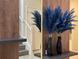 Entryway with a staircase, modern decor, and a mirrored accent wall at 4473 Kaipo Rd, Davenport, FL 33897