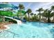 Resort-style pool featuring water slides and lush tropical landscaping at 4473 Kaipo Rd, Davenport, FL 33897