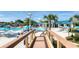 Large outdoor pool area with lounge chairs and sun umbrellas provides ample space for relaxation at 4473 Kaipo Rd, Davenport, FL 33897