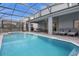 Enjoy the private screened in pool with hot tub and covered patio for relaxing or entertaining at 4473 Kaipo Rd, Davenport, FL 33897