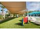 Community recreation area featuring a large connect four game, lounge chairs and shaded seating at 4473 Kaipo Rd, Davenport, FL 33897