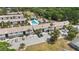 Community aerial view showing the pool, parking, and surrounding landscaping at 4722 Kilt Ct # 65, St Cloud, FL 34769