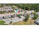 Community aerial view showing the pool, parking, and surrounding landscaping at 4722 Kilt Ct # 65, St Cloud, FL 34769