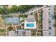 Birds eye view of community pool, tennis court, ample parking, & lush landscaping at 4722 Kilt Ct # 65, St Cloud, FL 34769