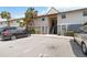 Exterior angle of condo featuring staircase entry and maintained landscaping at 4722 Kilt Ct # 65, St Cloud, FL 34769