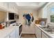 Efficient kitchen with white cabinets, stainless steel microwave, and modern appliances at 4722 Kilt Ct # 65, St Cloud, FL 34769
