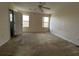 Spacious bedroom with dual windows providing ample natural light and ceiling fan at 4726 Hemingway House St, Kissimmee, FL 34746