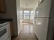 Breakfast nook with lots of windows, tile flooring, and a hanging chandelier at 4726 Hemingway House St, Kissimmee, FL 34746