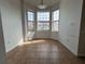 Bright dining area featuring tile flooring and large bay windows with neighborhood views at 4726 Hemingway House St, Kissimmee, FL 34746