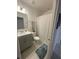 Compact bathroom with a shower featuring a patterned curtain, and a modern vanity at 505 Peace Way, Poinciana, FL 34759