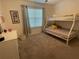 Comfortable bedroom featuring a bunk bed, closet, and window at 505 Peace Way, Poinciana, FL 34759