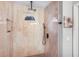 Contemporary shower with a rainfall showerhead, stylish tile work, and convenient built-in shelves at 5077 Ernst Ct # 3, Orlando, FL 32819