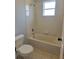 Bathroom featuring a shower over the bathtub at 511 Elbridge Pl, Kissimmee, FL 34758