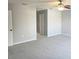 Neutral bedroom with carpet flooring, a ceiling fan, and a walk-in closet at 511 Elbridge Pl, Kissimmee, FL 34758