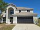 Beautiful two-story home with a spacious two-car garage and contemporary design elements at 511 Elbridge Pl, Kissimmee, FL 34758