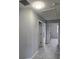 Neutral gray hallway showcasing carpeted floors and multiple doorways leading to other rooms at 511 Elbridge Pl, Kissimmee, FL 34758