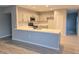Modern kitchen featuring quartz counters, stainless steel appliances, and generous counter space at 511 Elbridge Pl, Kissimmee, FL 34758