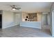 Open living space showing a kitchen with quartz counters, stainless appliances, and ample cabinets at 511 Elbridge Pl, Kissimmee, FL 34758