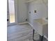 Laundry room featuring gray walls, a utility sink, and a door to the outside at 511 Elbridge Pl, Kissimmee, FL 34758