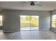 Spacious living room features a slider to the backyard allowing lots of natural light at 511 Elbridge Pl, Kissimmee, FL 34758