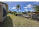 Backyard includes a chicken coop with a large grassy area, perfect for pets or other outdoor activities at 5572 Myakka Ave, Intercession City, FL 33848
