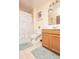 Comfortable bathroom with a bathtub and a vanity with wooden cabinets at 5572 Myakka Ave, Intercession City, FL 33848