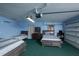 Garage has been converted to a bedroom and features three beds and a dresser at 5572 Myakka Ave, Intercession City, FL 33848