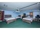 Garage has been converted to a bedroom and features three beds and a dresser at 5572 Myakka Ave, Intercession City, FL 33848