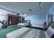 Garage has been converted to a bedroom and features three beds and a dresser, plus a treadmill at 5572 Myakka Ave, Intercession City, FL 33848