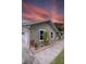 Charming single-story home with a well-maintained exterior, lush landscaping, and a convenient garage at 5572 Myakka Ave, Intercession City, FL 33848