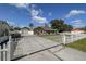 Charming home featuring a gated driveway, well-maintained lawn, and a detached garage at 5572 Myakka Ave, Intercession City, FL 33848