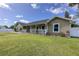 Inviting home featuring a charming front porch and well-maintained landscaping, enhancing curb appeal at 5572 Myakka Ave, Intercession City, FL 33848