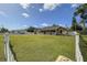 Charming single-story home with a well-maintained lawn and classic white picket fence, offering privacy at 5572 Myakka Ave, Intercession City, FL 33848