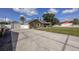 Charming single-story home with a well-maintained lawn, detached garage, and a classic white picket fence at 5572 Myakka Ave, Intercession City, FL 33848