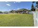 Charming single-story home with a well-maintained lawn and classic white picket fence, offering privacy at 5572 Myakka Ave, Intercession City, FL 33848