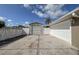 View of detached garage and driveway featuring ample parking space and clean, modern design at 5572 Myakka Ave, Intercession City, FL 33848