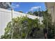 Outdoor garden showcasing vibrant plants and a sturdy white fence, ideal for gardening enthusiasts at 5572 Myakka Ave, Intercession City, FL 33848