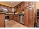 Spacious kitchen with stainless steel appliances, granite counters, and ample cabinetry for storage at 5572 Myakka Ave, Intercession City, FL 33848