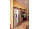 Kitchen featuring stainless steel appliances, granite counters, and hardwood floors at 5572 Myakka Ave, Intercession City, FL 33848