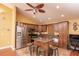Kitchen featuring stainless steel appliances, granite countertops, and a center island at 5572 Myakka Ave, Intercession City, FL 33848