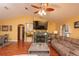 Comfortable living room featuring a fireplace, high ceilings, and plenty of natural light at 5572 Myakka Ave, Intercession City, FL 33848