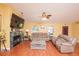 Bright living room with a fireplace, recessed lighting, and comfortable seating at 5572 Myakka Ave, Intercession City, FL 33848