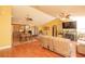 Open-concept living space connecting the kitchen, dining area, and comfortable seating area at 5572 Myakka Ave, Intercession City, FL 33848