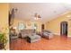 Bright living room featuring laminate floors, recessed lighting, and comfortable seating at 5572 Myakka Ave, Intercession City, FL 33848
